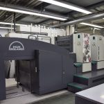 Modern four-colour sheetfed offset printing press in a print workshop