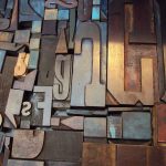 Assorted vintage wooden letterpress type blocks in different sizes and fonts