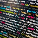 Close-up of colourful HTML and JavaScript source code on a computer screen