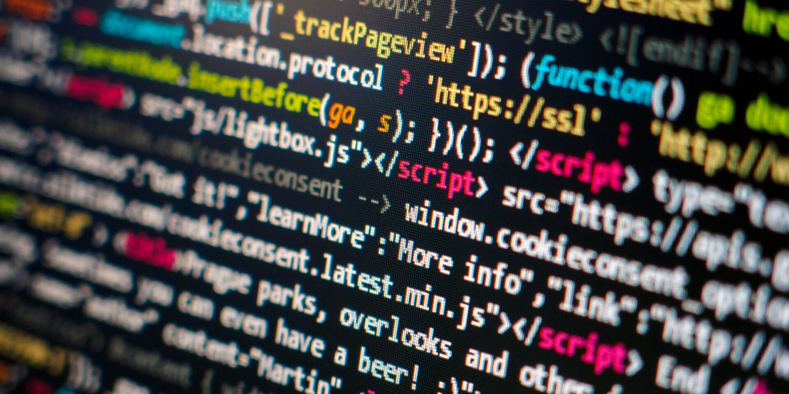 Close-up of colourful HTML and JavaScript source code on a computer screen